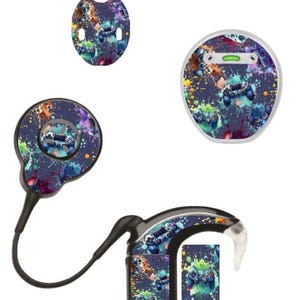 May include: A collection of hearing aid accessories featuring a colorful splatter design with video game controller graphics. The set includes various components, such as a receiver, a battery door, and a small sticker.