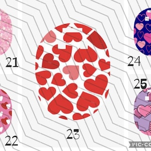 May include: A collage of five oval designs featuring heart patterns. Designs include pink glitter, red hearts on white, pink and red hearts, pink and purple hearts, and a blue background with pink hearts. Numbers 21, 22, 23, 24, and 25 are visible.