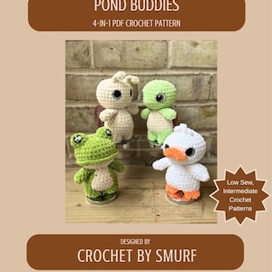 May include: A crochet pattern cover showing four amigurumi pond creatures: a frog, a turtle, a duck, and a dragonfly. The text "POND BUDDIES" and "4-IN-1 PDF CROCHET PATTERN" are displayed. The designer's name is "CROCHET BY SMURF".