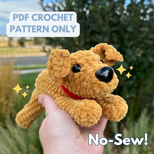 May include: A crocheted plush dog toy in a light brown color with a red collar. The toy is being held in a hand and the text "No-Sew!" is visible in the bottom right corner. The text "PDF CROCHET PATTERN ONLY" is visible in the top left corner.