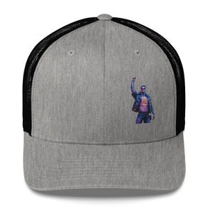 May include: A gray and black trucker hat with a pixelated image of a person in a blue jacket with their fist raised in the air.