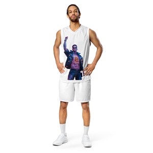 May include: White basketball jersey with a graphic print of a man in a leather jacket with a Bitcoin symbol on his chest. The man is raising his fist in the air.