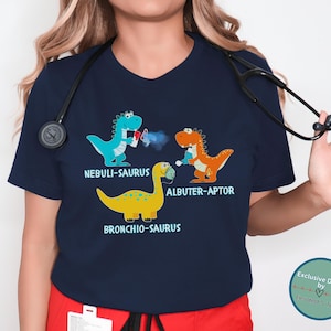 Camiseta divertida de terapeuta respiratorio, camiseta de dinosaurio para terapia respiratoria pediátrica, camiseta personalizada para pediatras y enfermeras, camiseta de equipo de UCIP RRT