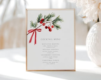 May include: A framed cocktail menu with a gold border. The menu features a watercolor illustration of a sprig of holly with red berries and a red ribbon. The menu lists four cocktails: Mistletoe Martini, Holiday Sangria, Cranberry Cocktail, and Christmas Punch.