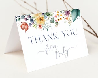 May include: A white thank you card with a watercolor floral border in shades of yellow, orange, pink, purple, and green. The text "THANK YOU from: Baby" is printed in blue.