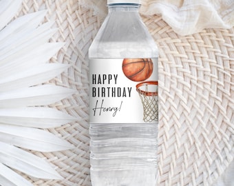 May include: A white water bottle with a label that says "Happy Birthday Henry!" and features a basketball going through a hoop.