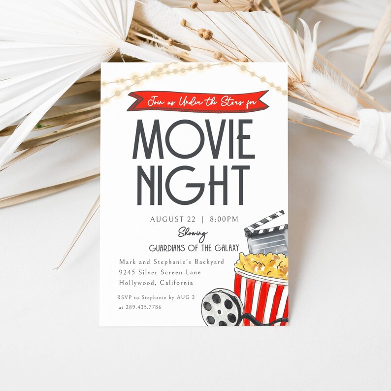 Movie Night Invitation. Join us Under the Stars. Watercolor Popcorn Tub, film roll and Clapper. Red Banner and Twinkly lights. Dark Gray Fonts and White Background. Print or send digitally. 5x7.
