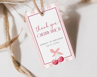May include: A rectangular gift tag with a pink and white striped background and a thin pink border. The tag reads "thank you CHERRY MUCH" in a script font, with "Emma's 1st Birthday" and the date below. A cherry illustration is at the bottom.