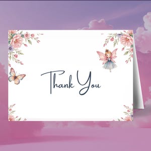 May include: A folded white card with the words "Thank You" in elegant script. The card features watercolor illustrations of a butterfly, a fairy, and floral accents in pink, purple, and green. The background is a gradient of pink and purple.