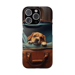 May include: A brown and white dog with its head sticking out of a brown leather suitcase. The suitcase has a blue lining and a brown leather handle.
