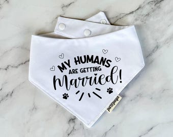 May include: White dog bandana with black text that says "My humans are getting married!" with paw prints and hearts.