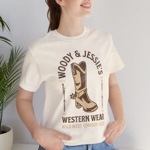 Toy Story Shirt - Woody and Jessies Western Wear Unisex Light Weight Jersey Short Sleeve Tee - Woodys Round Up - Rootinest Tootinest Cowboy Natural