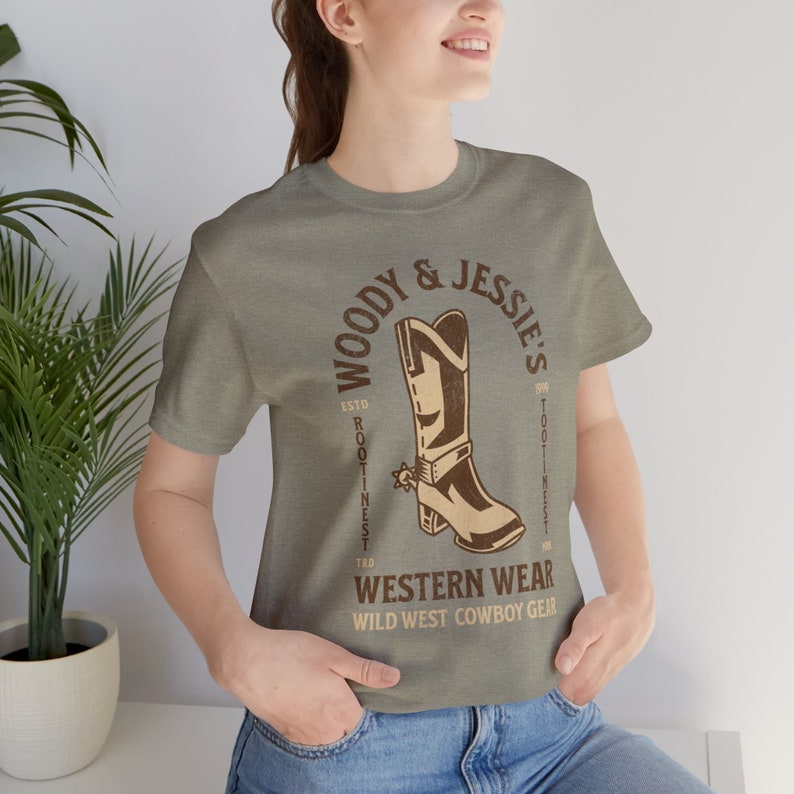 Toy Story Shirt - Woody and Jessies Western Wear Unisex Light Weight Jersey Short Sleeve Tee - Woodys Round Up - Rootinest Tootinest Cowboy Heather Stone