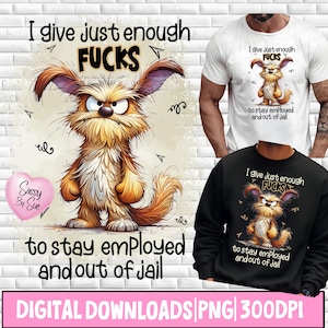 May include: The image shows a cartoon illustration of a grumpy, furry creature with the text "I give just enough FUCKS to stay employed and out of jail." The design is on a white t-shirt and a black sweatshirt. A pink heart with "Sassy By Sue" is also present.