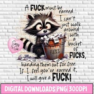 May include: Digital download featuring a raccoon holding a bucket of "Fucks" with text. The raccoon is black, white, and gray, with a pink heart-shaped balloon that says "Sassy By Sue". The image is set against a white brick wall.