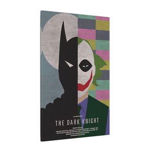May include: Canvas print of Batman and the Joker from "The Dark Knight." The artwork is split, with Batman's silhouette on the left against a moon, and the Joker's face and a checkered pattern on the right.