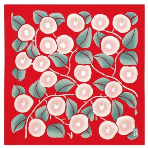 May include: A red fabric square with a repeating pattern of white and pink camellia flowers and green leaves.