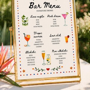 Whimsical floral wedding bar menu sign with colorful folk art border and illustrated drinks, editable Canva template displayed on easel and table settings
