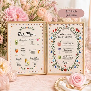 Whimsical floral wedding bar menu sign with colorful folk art border and illustrated drinks, editable Canva template displayed on easel and table settings