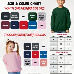 a child's sweater with a picture of a young boy and a young girl
