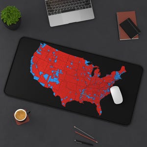 May include: A black mousepad with a map of the United States. The map is divided into red and blue squares, representing different political districts.