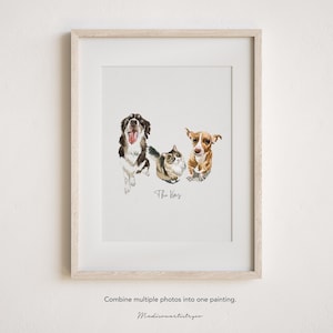 May include: A watercolor painting of a brown and white dog, a black and white cat, and a brown and white dog. The painting is framed in a light wood frame and has the text "The Kears" written below the animals.