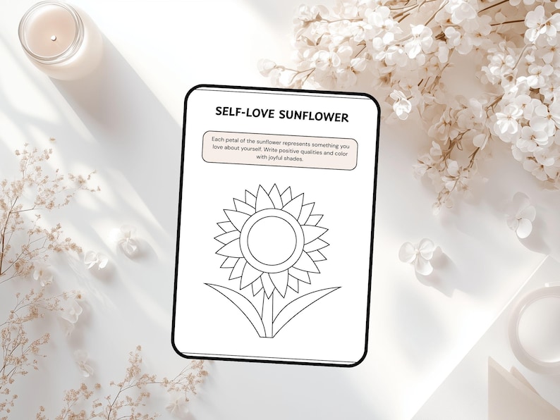 May include: A black and white coloring page with the text "SELF-LOVE SUNFLOWER" and instructions to write positive qualities and color the sunflower. The image is on a white surface with a candle and floral accents.