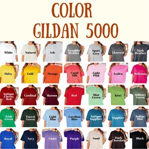 May include: A color chart of Gildan 5000 t-shirts, showcasing a variety of colors including white, black, and various shades of blue, green, and red. The text "COLOR GILDAN 5000" is displayed at the top.