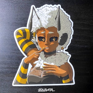 May include: A sticker featuring a cartoon character with a bee-themed outfit. The character has yellow and black striped sleeves, a fluffy white hairdo, and a black and gold outfit. The character is smiling and has large, expressive eyes.
