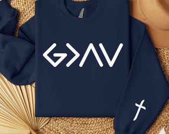 May include: Navy blue sweatshirt with white lettering that reads "G>A>V" and a white cross on the left sleeve.