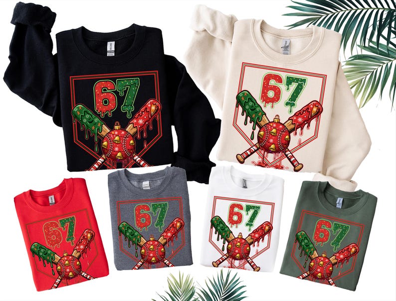 May include: A collection of sweatshirts in various colors, including black, red, white, and gray. Each sweatshirt features a graphic of a baseball with the number 67, crossed bats, and festive dripping accents. The design is set within a diamond shape.