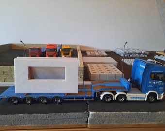 Pequenas paredes pré-moldadas e estruturas de transporte em escala 1:50. Impressas em 3D.