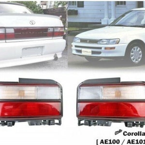 May include: A pair of red and white tail lights for a Toyota Corolla AE100/AE101 series car. The tail lights are new and have a clear lens with a red and white reflector.