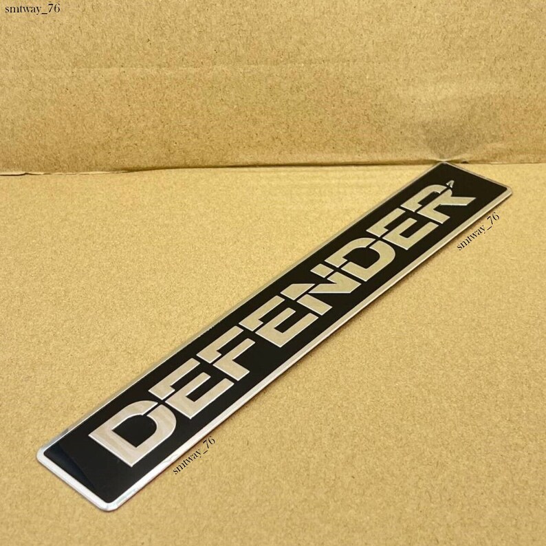 Genuine Land Rover Front Grille Emblem For Defender 90 110 (1987-2016) | Black & Silver Oval Badge MXC6402