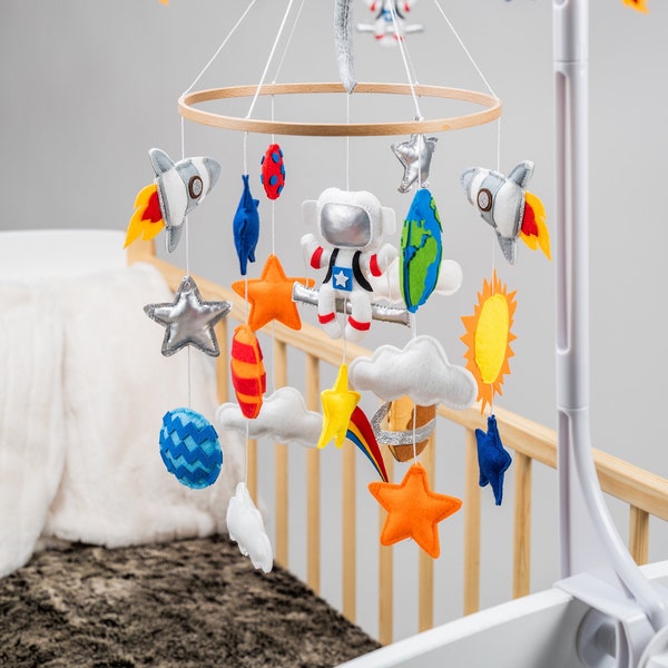 Space baby crib mobile with rockets, planets and stars including matching garland