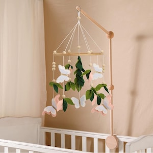 Butterfly Baby Mobile: A beautiful butterfly  Crib mobile with white and butterflies and  Gold Detail with two shades of green leaves