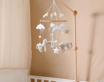 Neutral baby mobile safari design in soft shades