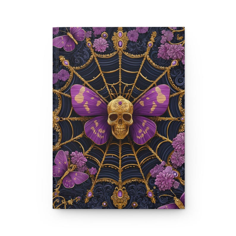 Hardcover journal featuring an ornate gothic design of a golden skull with purple butterfly wings at the center of a golden spiderweb. Surrounded by rich purple flowers, butterflies, and intricate details, all set against a dark, swirling background.