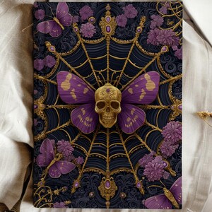 Hardcover journal featuring an ornate gothic design of a golden skull with purple butterfly wings at the center of a golden spiderweb. Surrounded by rich purple flowers, butterflies, and intricate details, all set against a dark, swirling background.