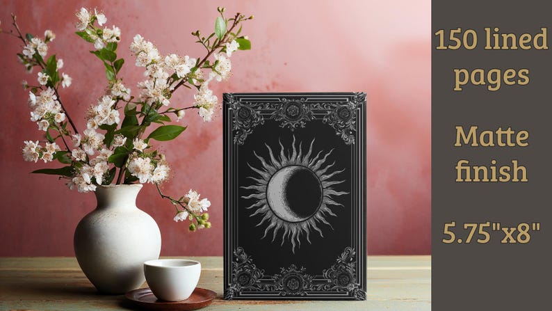 Let your thoughts drift into the mystical with this Gothic Sun & Moon Eclipse Journal. The ornate vintage border and celestial centerpiece make it the perfect notebook for witches, poets, and dark academia lovers alike.