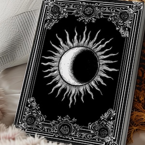 Let your thoughts drift into the mystical with this Gothic Sun & Moon Eclipse Journal. The ornate vintage border and celestial centerpiece make it the perfect notebook for witches, poets, and dark academia lovers alike.
