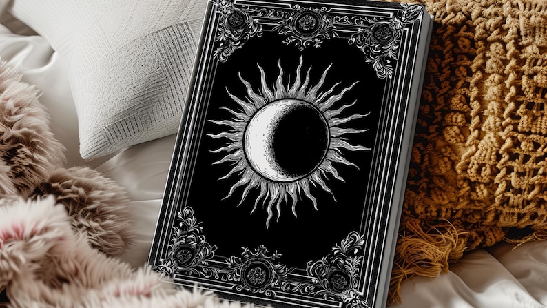 Let your thoughts drift into the mystical with this Gothic Sun & Moon Eclipse Journal. The ornate vintage border and celestial centerpiece make it the perfect notebook for witches, poets, and dark academia lovers alike.