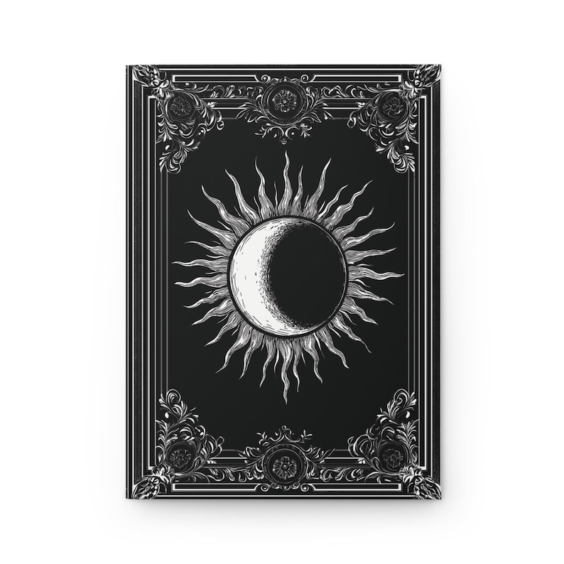Let your thoughts drift into the mystical with this Gothic Sun & Moon Eclipse Journal. The ornate vintage border and celestial centerpiece make it the perfect notebook for witches, poets, and dark academia lovers alike.