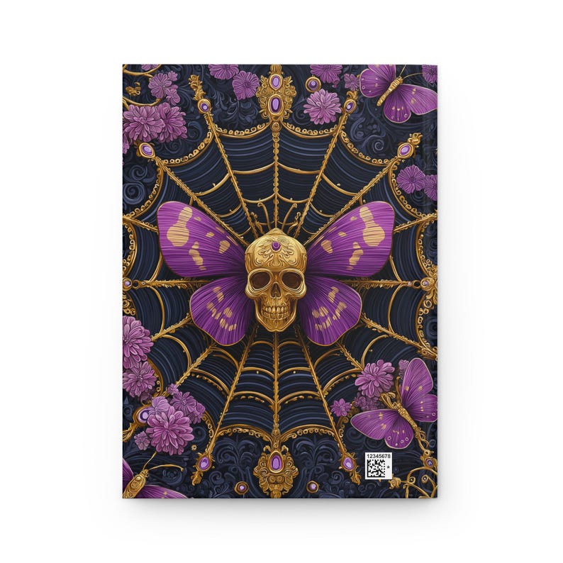 Hardcover journal featuring an ornate gothic design of a golden skull with purple butterfly wings at the center of a golden spiderweb. Surrounded by rich purple flowers, butterflies, and intricate details, all set against a dark, swirling background.
