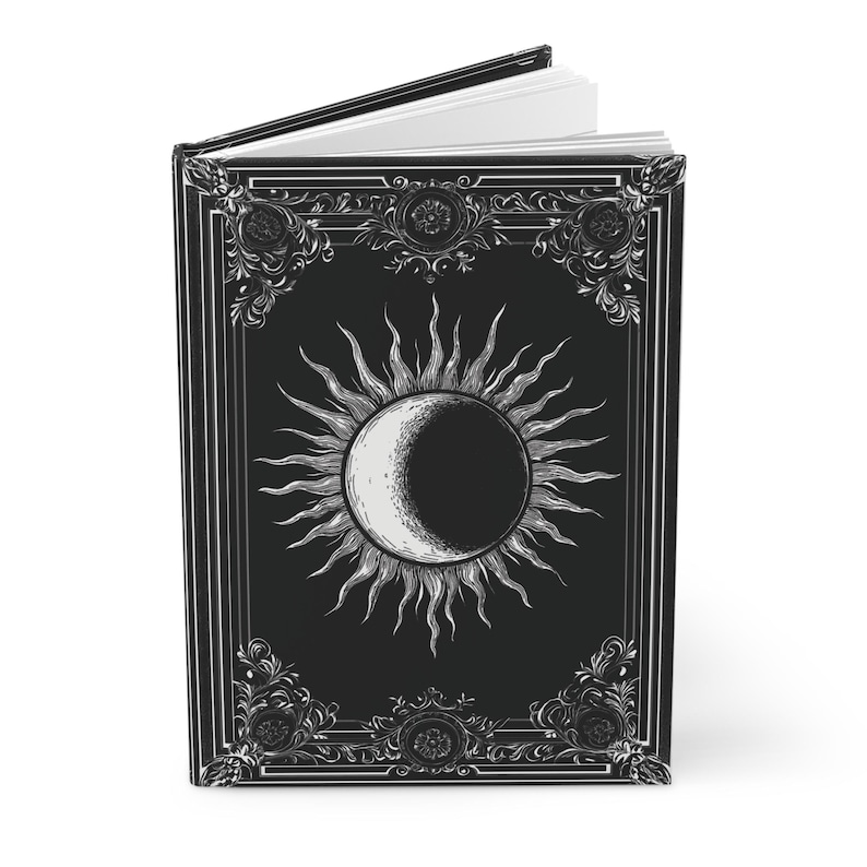 Let your thoughts drift into the mystical with this Gothic Sun & Moon Eclipse Journal. The ornate vintage border and celestial centerpiece make it the perfect notebook for witches, poets, and dark academia lovers alike.