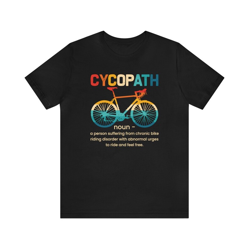May include: Black t-shirt with a vintage-style graphic of a bicycle and the text "CYCOPATH" defined as "a person suffering from chronic bike riding disorder with abnormal urges to ride and feel free."