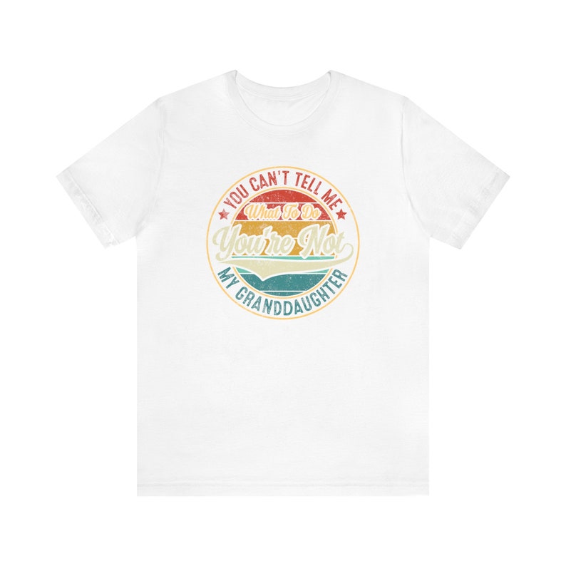 May include: White t-shirt with a vintage-style graphic that says "You can't tell me what to do, you're not my granddaughter".