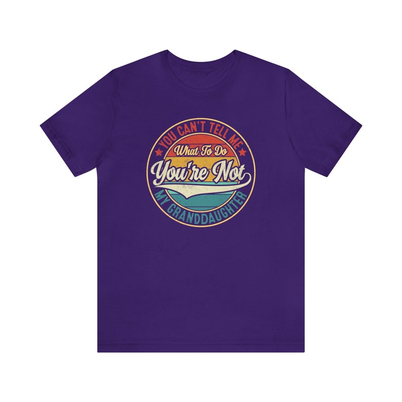 May include: Purple t-shirt with a vintage-style graphic that says "You Can't Tell Me What To Do You're Not My Granddaughter".