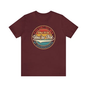 May include: A maroon t-shirt with a vintage-style graphic that says "You Can't Tell Me What To Do You're Not My Granddaughter".