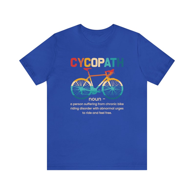 May include: A blue t-shirt with a graphic of a bicycle and the text "CYCOPATH" in rainbow colors. The text below the graphic reads "noun - a person suffering from chronic bike riding disorder with abnormal urges to ride and feel free."